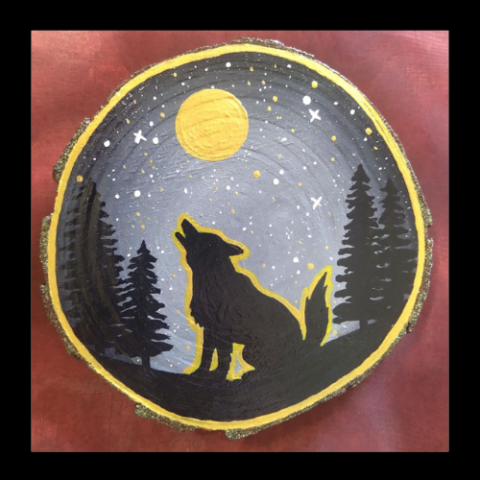 Wolf painted on wood slice